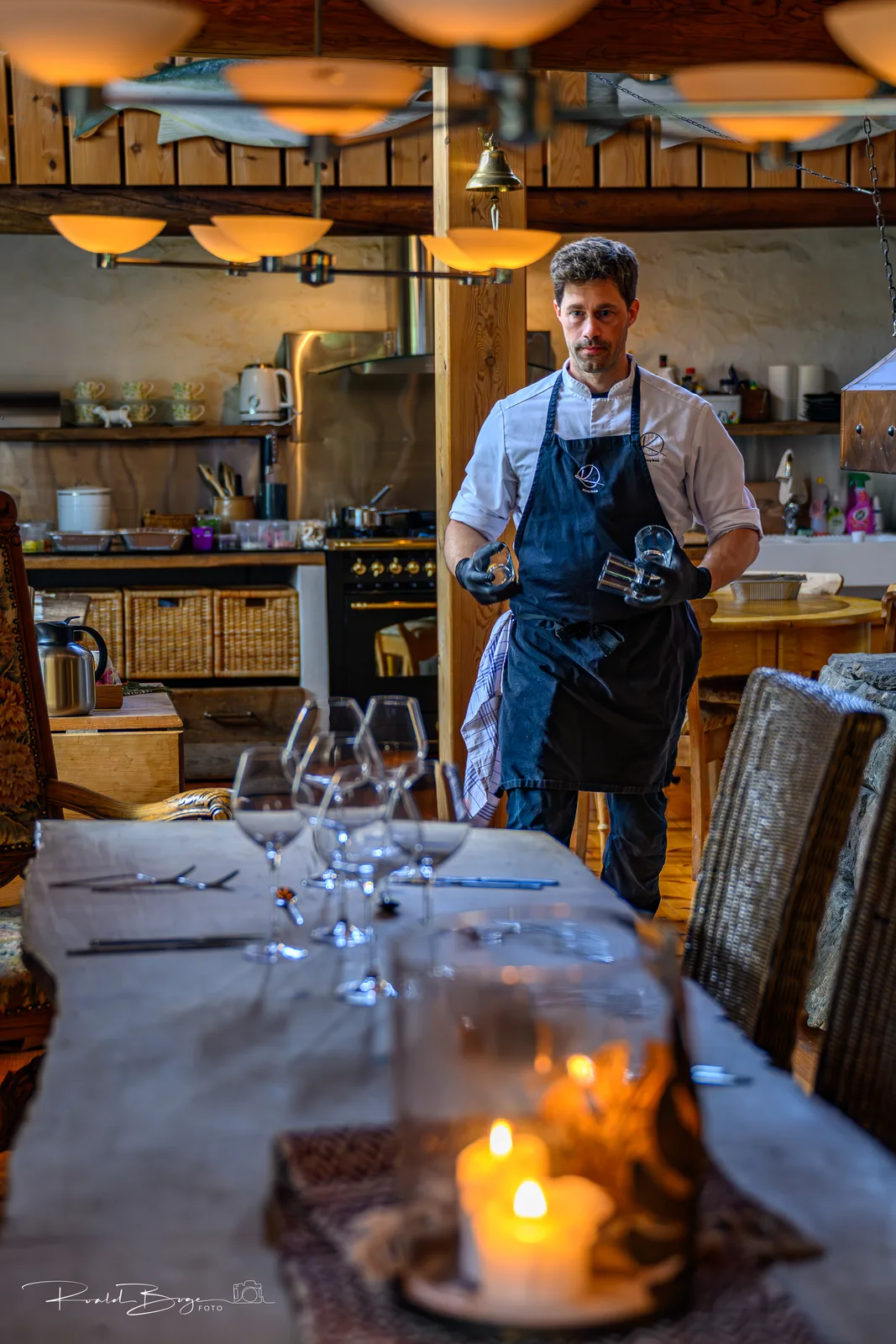 The chef preparing at the long table