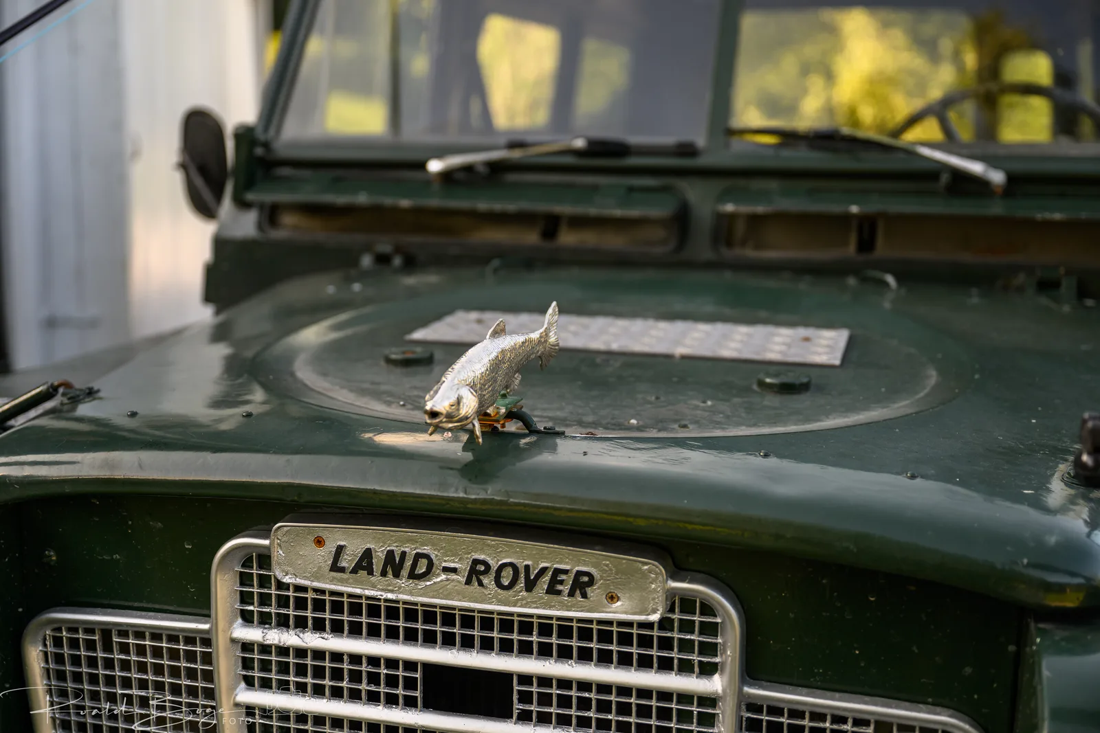 Land Rover bonnet with a fly reel