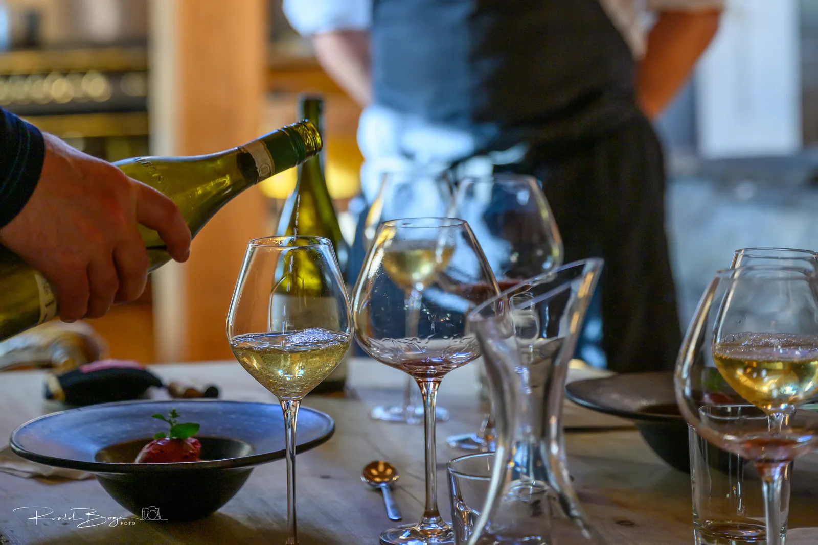 Wine being poured at the table